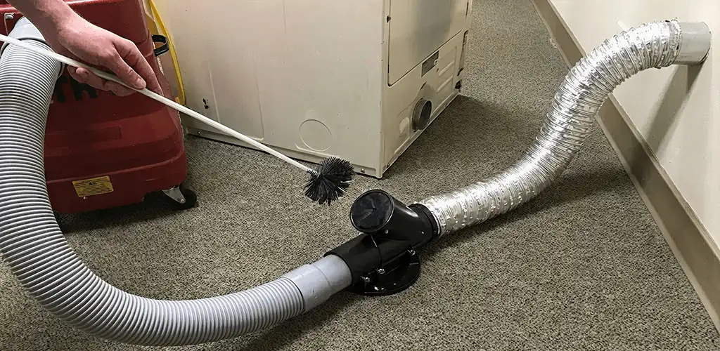 Dryer vent cleaning service removing lint from a dryer duct connection in Tallahassee, FL