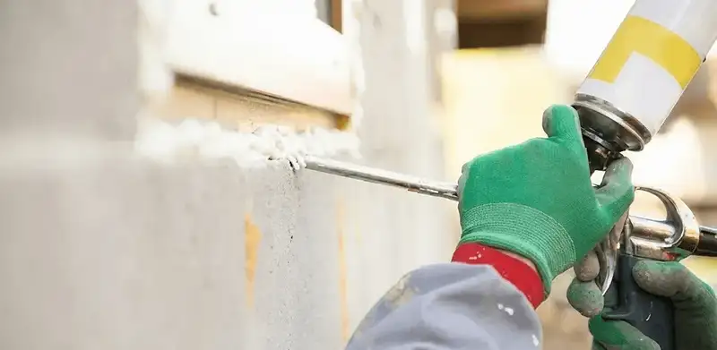 Handyman sealing exterior gaps with caulk for weatherproofing in Tallahassee, FL